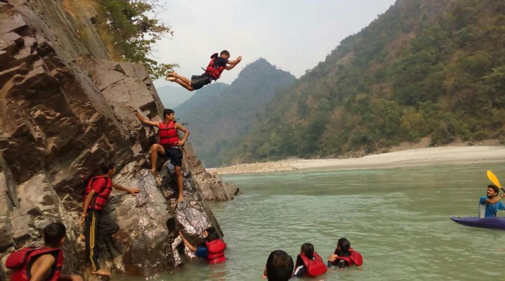 Cliff jumping during a rafting stop