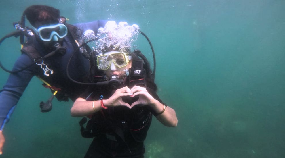 Girl expressing her happiness while diving in Malvan